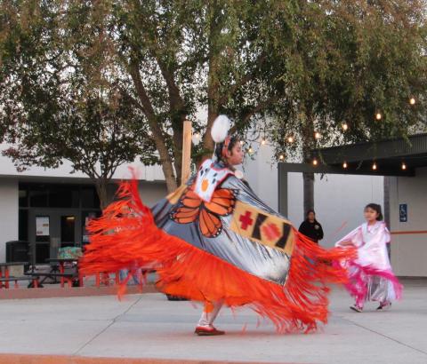 Four Directions club member Kimani Sanchez joins others in a Fancy Shawl dance Four Directions club member Kimani Sanchez joins others in a Fancy Shawl dance