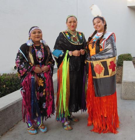 Fancy Shawl dancers, from left, Su’la Arviso, Tekla Diaz, and Kimani Sanchez wait for their turn to perform at the Gathering of the People event, Nov. 16 Fancy Shawl dancers, from left, Su’la Arviso, Tekla Diaz, and Kimani Sanchez wait for their turn to perform at the Gathering of the People event, Nov. 16