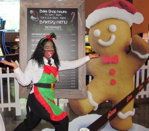 Soboba Casino Resort employee Dianna Mingoes is one of Santa’s enthusiastic helpers who takes orders for the bake shop when guests enter Gingerbread Lane Soboba Casino Resort employee Dianna Mingoes is one of Santa’s enthusiastic helpers who takes orders for the bake shop when guests enter Gingerbread Lane