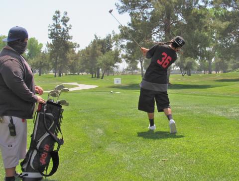 Team Soboba’s Jeremiah Ramos takes a swing while Assistant Coach Mike Durrett watches during the Inter Tribal Sports day at Soboba Springs Golf Course on April 17 Team Soboba’s Jeremiah Ramos takes a swing while Assistant Coach Mike Durrett watches during the Inter Tribal Sports day at Soboba Springs Golf Course on April 17
