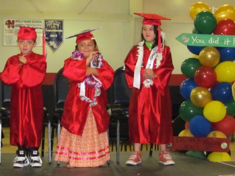 From left, Kindergartners Sonny Small, Madison Swan and Jason Valenzuella use American Sign Language while performing a song for friends and family at their graduation ceremony at the Soboba Sports Complex on June 2 From left, Kindergartners Sonny Small, Madison Swan and Jason Valenzuella use American Sign Language while performing a song for friends and family at their graduation ceremony at the Soboba Sports Complex on June 2