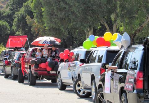 Decorated vehicles lined up at The Oaks on June 26 in preparation of a parade to celebrate all tribal members graduating from various grades and schools this year Decorated vehicles lined up at The Oaks on June 26 in preparation of a parade to celebrate all tribal members graduating from various grades and schools this year