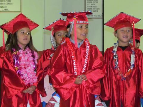 Pre-K students perform for family and friends at their promotion ceremony on June 15. From left, Nayeli Brittian, Anthony Torres (in back), Paa’ayat Arviso and Kane Calderon Pre-K students perform for family and friends at their promotion ceremony on June 15. From left, Nayeli Brittian, Anthony Torres (in back), Paa’ayat Arviso and Kane Calderon