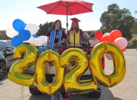 College graduate Raven Peterson, left and high school graduate Mariah Morreo, are cousins who participated in a Student Recognition Parade for Soboba tribal members on June 26 College graduate Raven Peterson, left and high school graduate Mariah Morreo, are cousins who participated in a Student Recognition Parade for Soboba tribal members on June 26
