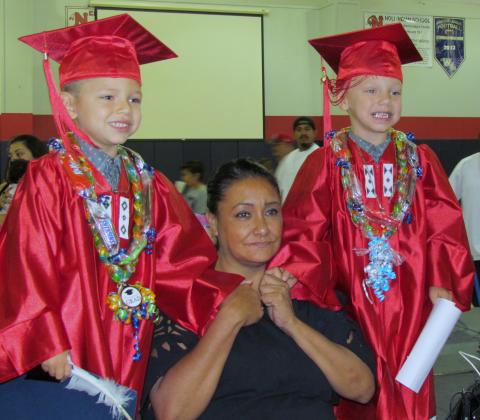 Twin brothers Gabriel and Gilbert Bentancourt are all smiles posing with their grandmother, Jessica Bentancourt, after being promoted to kindergarten on June 15 at the Soboba Sports Complex Twin brothers Gabriel and Gilbert Bentancourt are all smiles posing with their grandmother, Jessica Bentancourt, after being promoted to kindergarten on June 15 at the Soboba Sports Complex