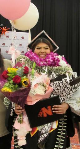 Salutatorian Sophia Resvaloso has her hands full with congratulatory flowers and gifts to celebrate her graduation from Noli Indian School, June 4 Salutatorian Sophia Resvaloso has her hands full with congratulatory flowers and gifts to celebrate her graduation from Noli Indian School, June 4