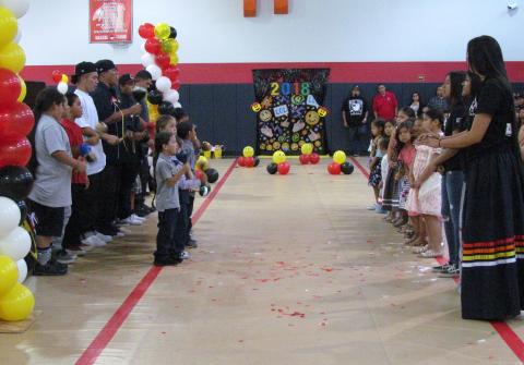 After shedding their caps and gowns, kindergarten students joined bird singers and dancers as part of the Class of 2018 graduation celebration After shedding their caps and gowns, kindergarten students joined bird singers and dancers as part of the Class of 2018 graduation celebration