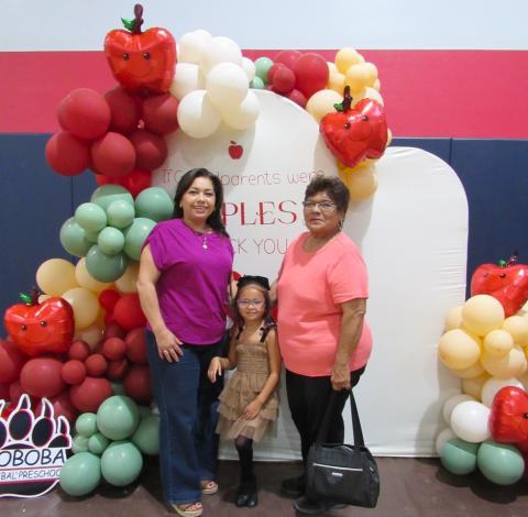 Kindergartner Nolani Miranda is happy to celebrate with grandmothers Lily Ruvalcaba, left, and Dominga Torres Kindergartner Nolani Miranda is happy to celebrate with grandmothers Lily Ruvalcaba, left, and Dominga Torres