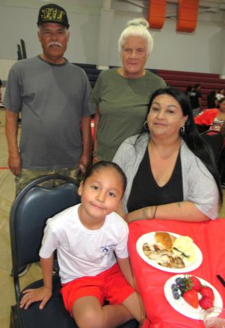 Kindergartner Kavikvish Medina is joined by grandparents Enrique Medina and Shannah Modesto, standing, and Amber Soza, seated Kindergartner Kavikvish Medina is joined by grandparents Enrique Medina and Shannah Modesto, standing, and Amber Soza, seated