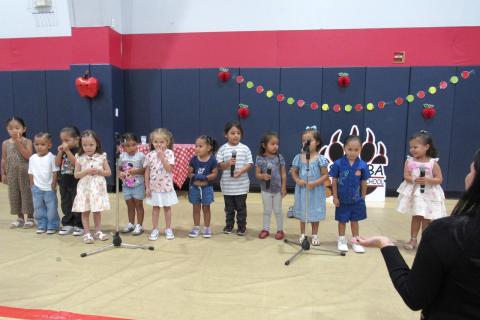 Preschool teacher Julissa Garcia, far right, leads her students in a special performance during the Grandparents Day Celebration, Sept. 11 Preschool teacher Julissa Garcia, far right, leads her students in a special performance during the Grandparents Day Celebration, Sept. 11