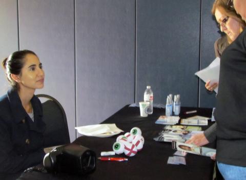 Riverside-San Bernardino County Indian Health, Inc. optometrist, Dinika Bagga, discusses eye health with guests at a free community health fair at the Soboba Sports Complex Riverside-San Bernardino County Indian Health, Inc. optometrist, Dinika Bagga, discusses eye health with guests at a free community health fair at the Soboba Sports Complex