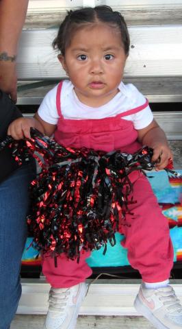 Sixteen-month-old Mayah Briones is the youngest cheerleader at Noli Indian School’s Homecoming game on Sept. 12. Soboba Band of Luiseño Indians photo Sixteen-month-old Mayah Briones is the youngest cheerleader at Noli Indian School’s Homecoming game on Sept. 12. Soboba Band of Luiseño Indians photo