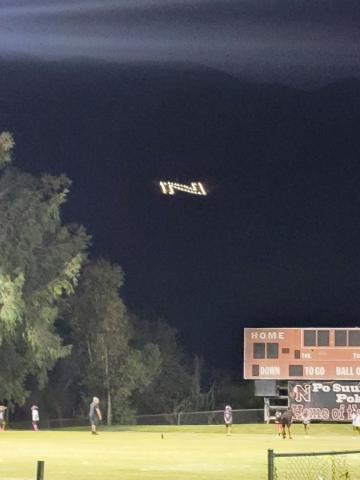 Thanks to the volunteer efforts of the Valdez family and others, N for Noli shines brightly above The Oaks football stadium during the school’s homecoming game Thanks to the volunteer efforts of the Valdez family and others, N for Noli shines brightly above The Oaks football stadium during the school’s homecoming game