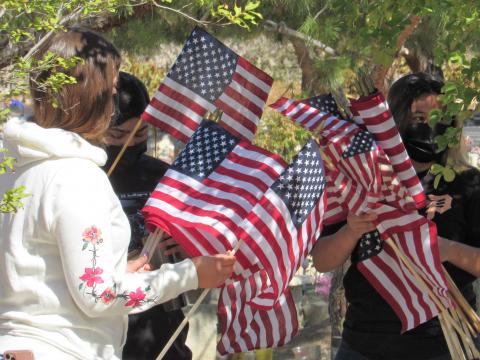 Soboba Youth Council members Tatiana Briones, Iyana Briones and Ciara Ramos carry flags to veterans’ gravesites at the Soboba Cemetery ahead of a Memorial Day ceremony there Soboba Youth Council members Tatiana Briones, Iyana Briones and Ciara Ramos carry flags to veterans’ gravesites at the Soboba Cemetery ahead of a Memorial Day ceremony there