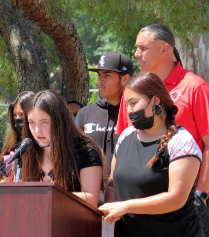 Emma Valenzuella, at the microphone, and Jocie Yepa, at the podium, took turns reading the last roll call, a military tradition that pays honor to deceased soldiers, during a Memorial Day ceremony at the Soboba Cemetery Veterans shrine on May 31 Emma Valenzuella, at the microphone, and Jocie Yepa, at the podium, took turns reading the last roll call, a military tradition that pays honor to deceased soldiers, during a Memorial Day ceremony at the Soboba Cemetery Veterans shrine on May 31
