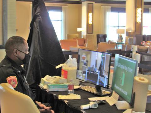 Barry Cole uses a thermal camera to check the temperatures of all arrivals. He has worked for Soboba’s security department for about 15 years Barry Cole uses a thermal camera to check the temperatures of all arrivals. He has worked for Soboba’s security department for about 15 years