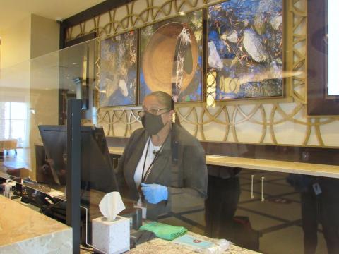 Stacia Cozart checks in a guest at the Soboba Casino Resort hotel on June 19. It reopened 100 of its rooms on June 15 Stacia Cozart checks in a guest at the Soboba Casino Resort hotel on June 19. It reopened 100 of its rooms on June 15