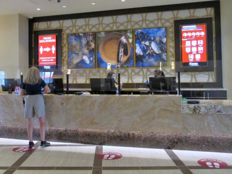 Kimberly Rice, left, disinfects the front desk area of the Soboba Casino Resort hotel between guests while Michelle Woodfin and Stacia Cozart assist them during the check in/out process on June 19 Kimberly Rice, left, disinfects the front desk area of the Soboba Casino Resort hotel between guests while Michelle Woodfin and Stacia Cozart assist them during the check in/out process on June 19