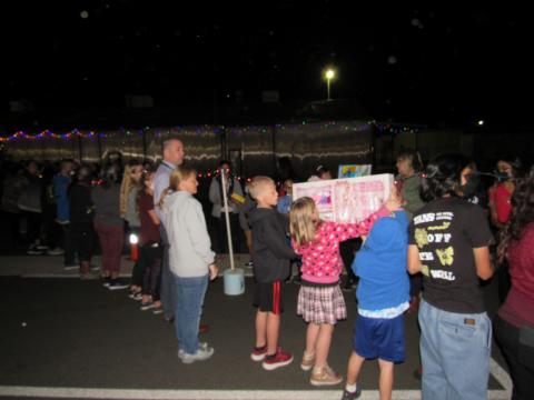 Community volunteers of all ages form a toy-passing brigade to transport 1,000 toys from the Soboba bus to the SJUSD warehouse on Nov. 29 Community volunteers of all ages form a toy-passing brigade to transport 1,000 toys from the Soboba bus to the SJUSD warehouse on Nov. 29