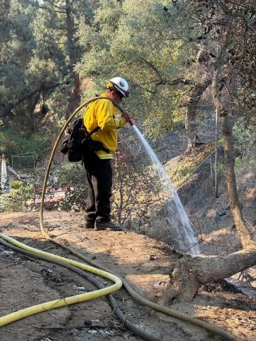 A Soboba Fire crew member mops up hotspots at a structure in Sierra Madre that burned during the Eaton Fire A Soboba Fire crew member mops up hotspots at a structure in Sierra Madre that burned during the Eaton Fire