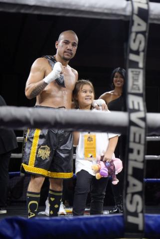 Professional boxer Jimmie Nunez Jr. with his daughter Mila in the ring after a recent win Professional boxer Jimmie Nunez Jr. with his daughter Mila in the ring after a recent win