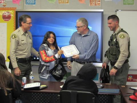 Riverside County Sheriff’s Office Captain Leonard Purvis, Soboba DPS Manager Brian Herritt and Deputy Sheriff Trent Tully congratulate MaryHelen Hurtado and other Noli Indian School students on their successful completion of a 12-week L.E.A.D. program Riverside County Sheriff’s Office Captain Leonard Purvis, Soboba DPS Manager Brian Herritt and Deputy Sheriff Trent Tully congratulate MaryHelen Hurtado and other Noli Indian School students on their successful completion of a 12-week L.E.A.D. program
