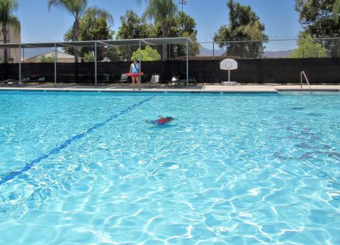 Lifeguard Avellaka Arviso watches a young swimmer at the Soboba Sports Complex pool on July 13 Lifeguard Avellaka Arviso watches a young swimmer at the Soboba Sports Complex pool on July 13