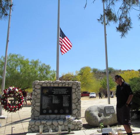 Soboba Parks and Recreation Director Andy Silvas pauses to reflect at the Soboba Veterans’ Memorial before the start of a Memorial Day ceremony on Monday, May 30