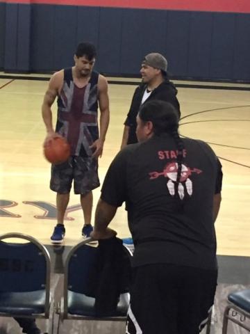 Native American actor Martin Sensmeier, left, and Ricardo Macias chat at the start of the Staff vs. Youth basketball game that took place before a screening of “The Magnificent 7” Native American actor Martin Sensmeier, left, and Ricardo Macias chat at the start of the Staff vs. Youth basketball game that took place before a screening of “The Magnificent 7”