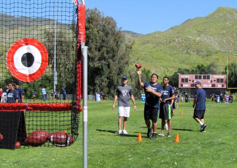 Edward Hill tosses a football towards a target at the quarterback station during an NFL Play Football skills clinic at Soboba on April 1 Edward Hill tosses a football towards a target at the quarterback station during an NFL Play Football skills clinic at Soboba on April 1