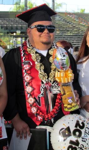 Gilbert Vallejo celebrates with friends and family after his graduation from Noli Indian School on June 6 Gilbert Vallejo celebrates with friends and family after his graduation from Noli Indian School on June 6