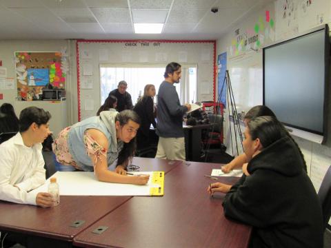 Noli Indian School sophomores share their idea for a new soda as part of a project to work together as a team to design a new product Noli Indian School sophomores share their idea for a new soda as part of a project to work together as a team to design a new product