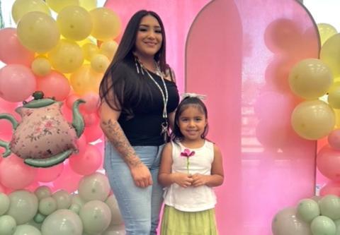 Paulina Aguirre holds the fabric flower she made with help from her cousin Brianna Estavillo during the Mother’s Day tea party, May 8 Paulina Aguirre holds the fabric flower she made with help from her cousin Brianna Estavillo during the Mother’s Day tea party, May 8