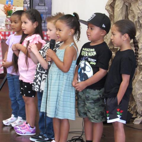 The preschool class sings songs about how much they love their fathers during a special day at the multipurpose room The preschool class sings songs about how much they love their fathers during a special day at the multipurpose room