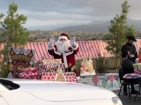 Santa and some helpers greeted each vehicle that drove through the Soboba Christmas Party on Dec. 12 and made sure each child received a present Santa and some helpers greeted each vehicle that drove through the Soboba Christmas Party on Dec. 12 and made sure each child received a present