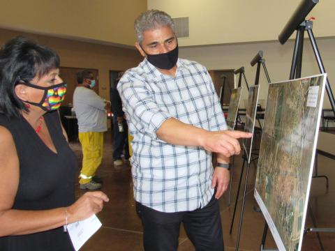 Soboba Housing Specialist Julie Padilla listens to a description of the upcoming water pipeline replacement project from ERSC Project Manager Moe Ahmadi at a recent community outreach event at the Soboba Reservation Soboba Housing Specialist Julie Padilla listens to a description of the upcoming water pipeline replacement project from ERSC Project Manager Moe Ahmadi at a recent community outreach event at the Soboba Reservation