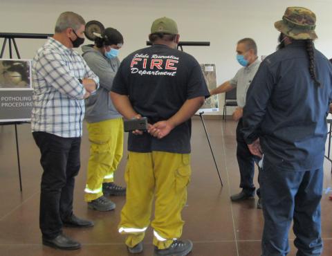 ERSC Project Engineer Reza Toorzani explains the water pipeline replacement project while ERSC Project Manager Moe Ahmadi, at far left, and Soboba Fire Department employees listen during a community outreach event on Oct. 6 ERSC Project Engineer Reza Toorzani explains the water pipeline replacement project while ERSC Project Manager Moe Ahmadi, at far left, and Soboba Fire Department employees listen during a community outreach event on Oct. 6