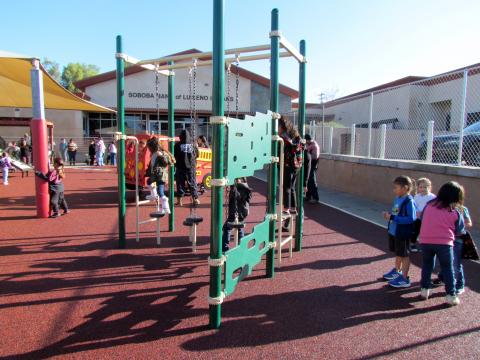 Children line up to try out the Jungle Traverse with its two-rung end access ladders Children line up to try out the Jungle Traverse with its two-rung end access ladders