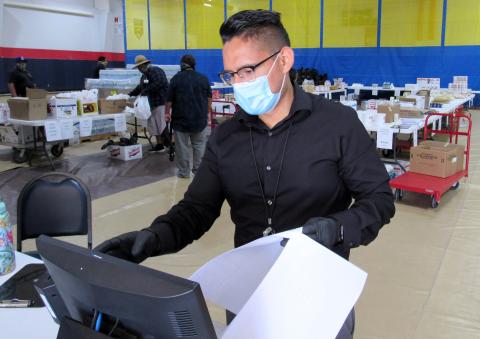 Ulises Pedraza from Soboba’s Accounting Department uses a pre-printed checklist to ring up a customer on May 13 at the Soboba Marketplace, a pop-up store for tribal members and employees Ulises Pedraza from Soboba’s Accounting Department uses a pre-printed checklist to ring up a customer on May 13 at the Soboba Marketplace, a pop-up store for tribal members and employees