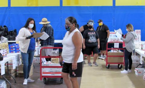 Jennifer Garcia, left, assists shopper Doris Placencia, center, with her purchases at the Soboba Marketplace while Vanessa San Vicente, far right, helps other Placencia family members with their lists on May 13 Jennifer Garcia, left, assists shopper Doris Placencia, center, with her purchases at the Soboba Marketplace while Vanessa San Vicente, far right, helps other Placencia family members with their lists on May 13