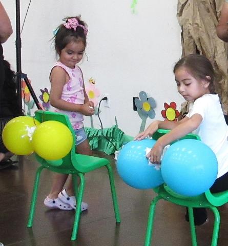 Khloe Razon, left. and Avelaka Leal have fun with the balloon wiping game at the Potty Training Event they attended with their younger siblings Khloe Razon, left. and Avelaka Leal have fun with the balloon wiping game at the Potty Training Event they attended with their younger siblings