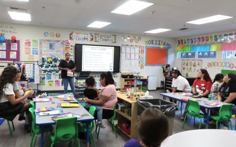 Preschool teacher Lenora “Ponie” Mojado shares plans for the new school year with families of her three-year-old students during a back-to-school night event on Aug. 25 Preschool teacher Lenora “Ponie” Mojado shares plans for the new school year with families of her three-year-old students during a back-to-school night event on Aug. 25