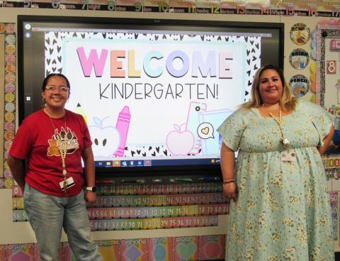 Instructional Aide Elena Vega Castello, left, and teacher Laura Aldrete welcome parents and students to their kindergarten classroom Instructional Aide Elena Vega Castello, left, and teacher Laura Aldrete welcome parents and students to their kindergarten classroom