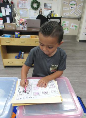 Pre-k student Levi Fuentes colors inside the lines while visiting his classroom during back-to-school night, Aug. 27 Pre-k student Levi Fuentes colors inside the lines while visiting his classroom during back-to-school night, Aug. 27