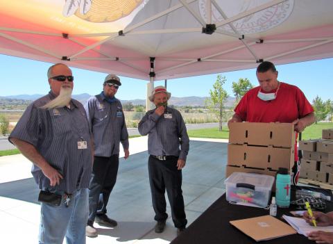 Andy Silvas, at right, prepares produce boxes for Soboba Public Works employees who checked in at the Soboba Foundation table on June 10 Andy Silvas, at right, prepares produce boxes for Soboba Public Works employees who checked in at the Soboba Foundation table on June 10