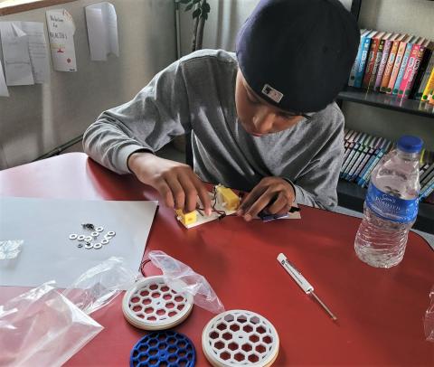 Anthony Pimentel concentrates on assembling a robot as part of the AISES at UCLA workshop held at Noli Indian School at the Soboba Reservation on March 9 Anthony Pimentel concentrates on assembling a robot as part of the AISES at UCLA workshop held at Noli Indian School at the Soboba Reservation on March 9