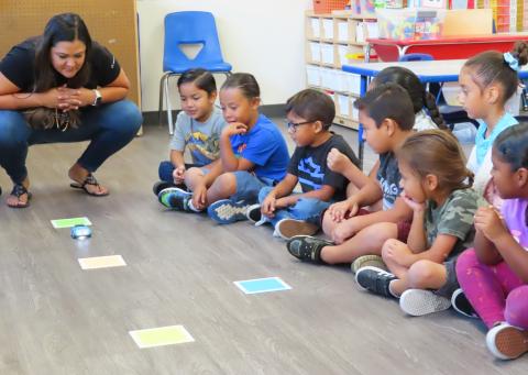Stacy Smith Ledford, PK-12 Student Success Program Officer for American Indian Science and Engineering Society, explains to Soboba Tribal Preschool kindergartners how to set up a “track” for the car-shaped robot to follow during a recent STEM lesson