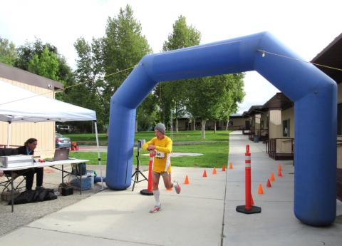 Rick Pfeiffer, of Carlsbad, checks his time as the first NATRO runner of the day to complete the 5K race Rick Pfeiffer, of Carlsbad, checks his time as the first NATRO runner of the day to complete the 5K race