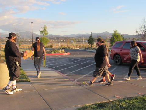 Head coach Ricardo Macias, left, encourages runners at a recent practice for the Inter Tribal Sports Cross Country team from Soboba Head coach Ricardo Macias, left, encourages runners at a recent practice for the Inter Tribal Sports Cross Country team from Soboba