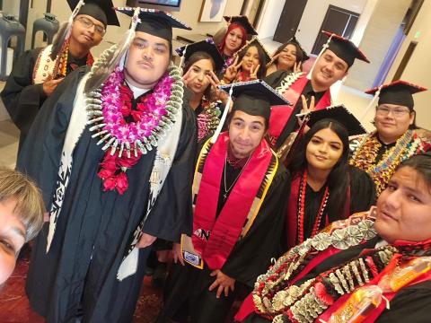 Noli Indian School teacher Jacquelin Phillips, left corner, takes a selfie with seniors prior to their commencement at the Soboba Casino Resort Event Center, June 4 Noli Indian School teacher Jacquelin Phillips, left corner, takes a selfie with seniors prior to their commencement at the Soboba Casino Resort Event Center, June 4